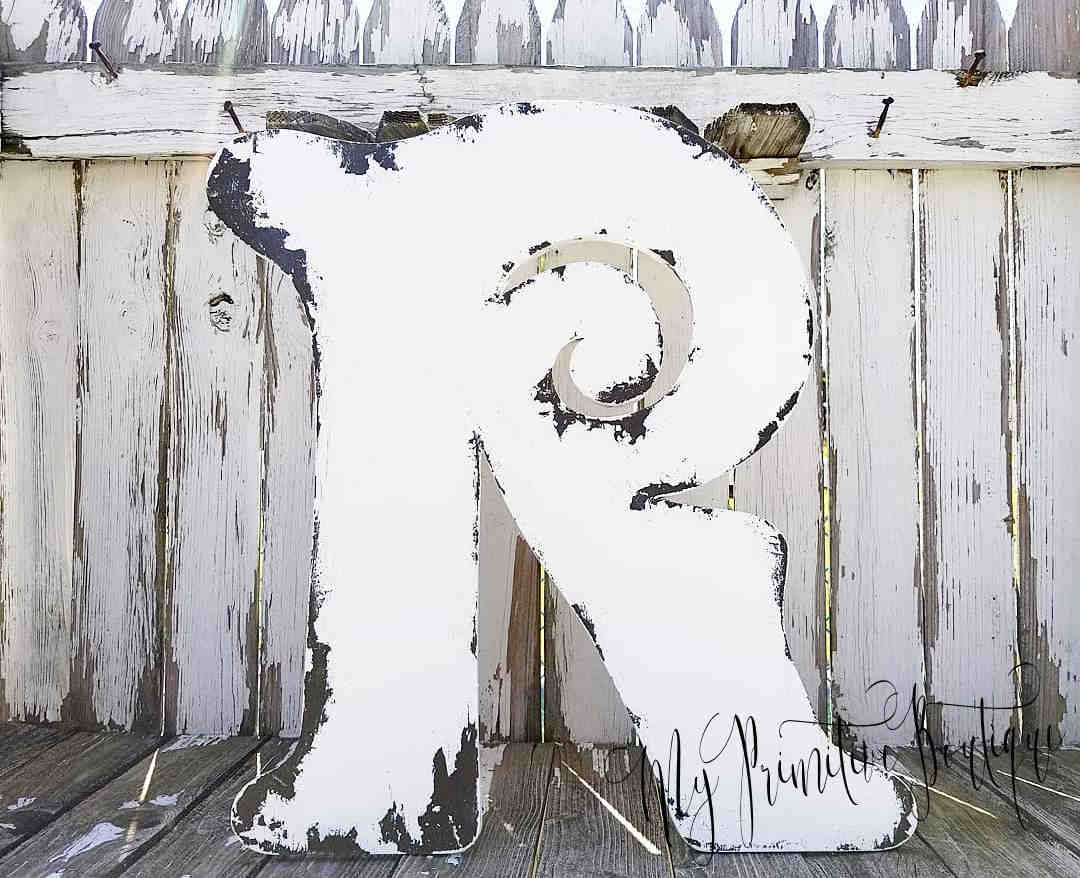 Large wooden decorative letter 'R' with a rustic rustic ivory finish