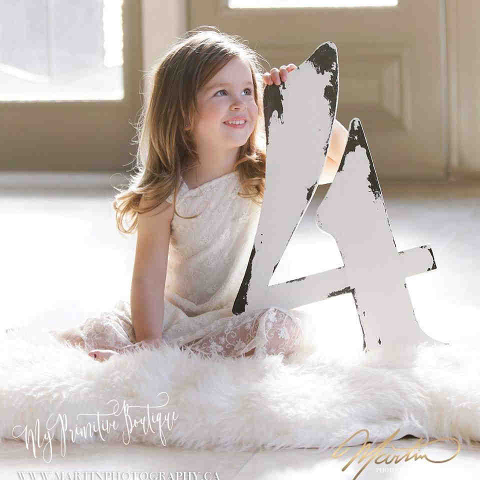 Our 2 ft wooden number 4 in our distressed ivory finish. A unique guest book idea.