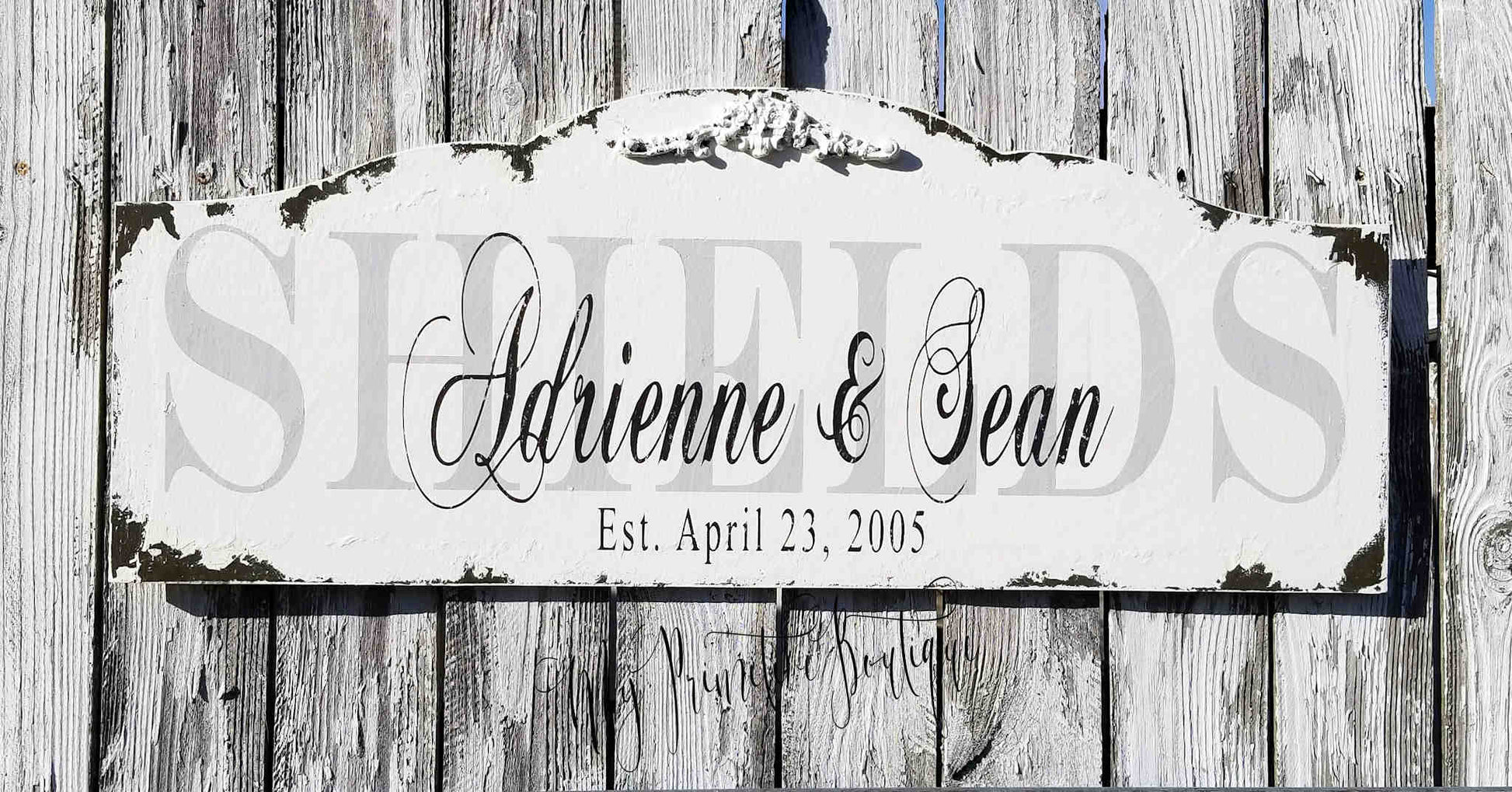 Personalized established family name sign distressed ivory finish with black lettering.