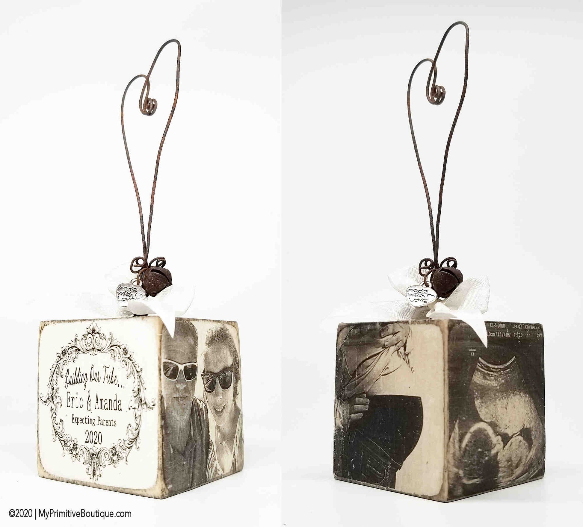 Rustic wooden maternity ornament hand painted with Building Our Tribe, personalized with names and date.