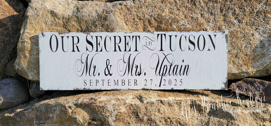 Rustic personalized wooden “We Eloped” wedding sign with last name and location