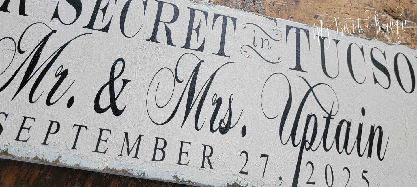 Distressed ivory hand-painted wedding sign with crisp black lettering