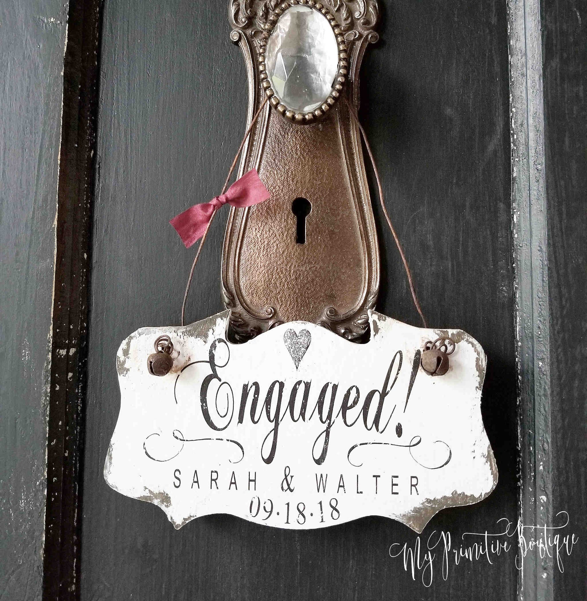 Unique personalized engaged ornament in our distressed ivory finish. Personalized with first names and date.