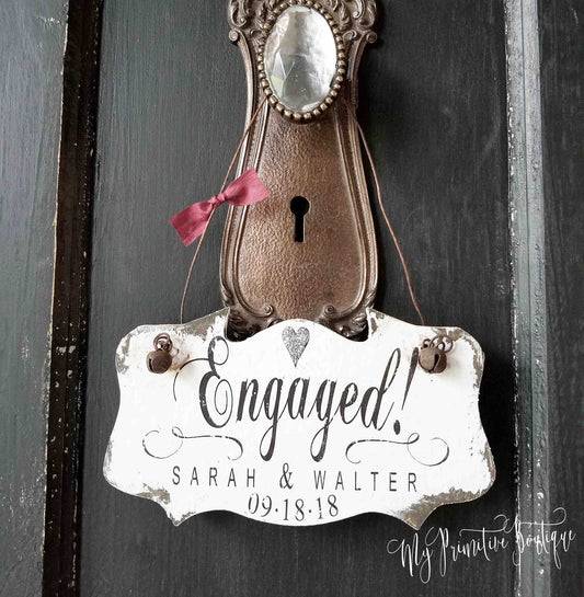 Unique personalized engaged ornament in our distressed ivory finish. Personalized with first names and date.