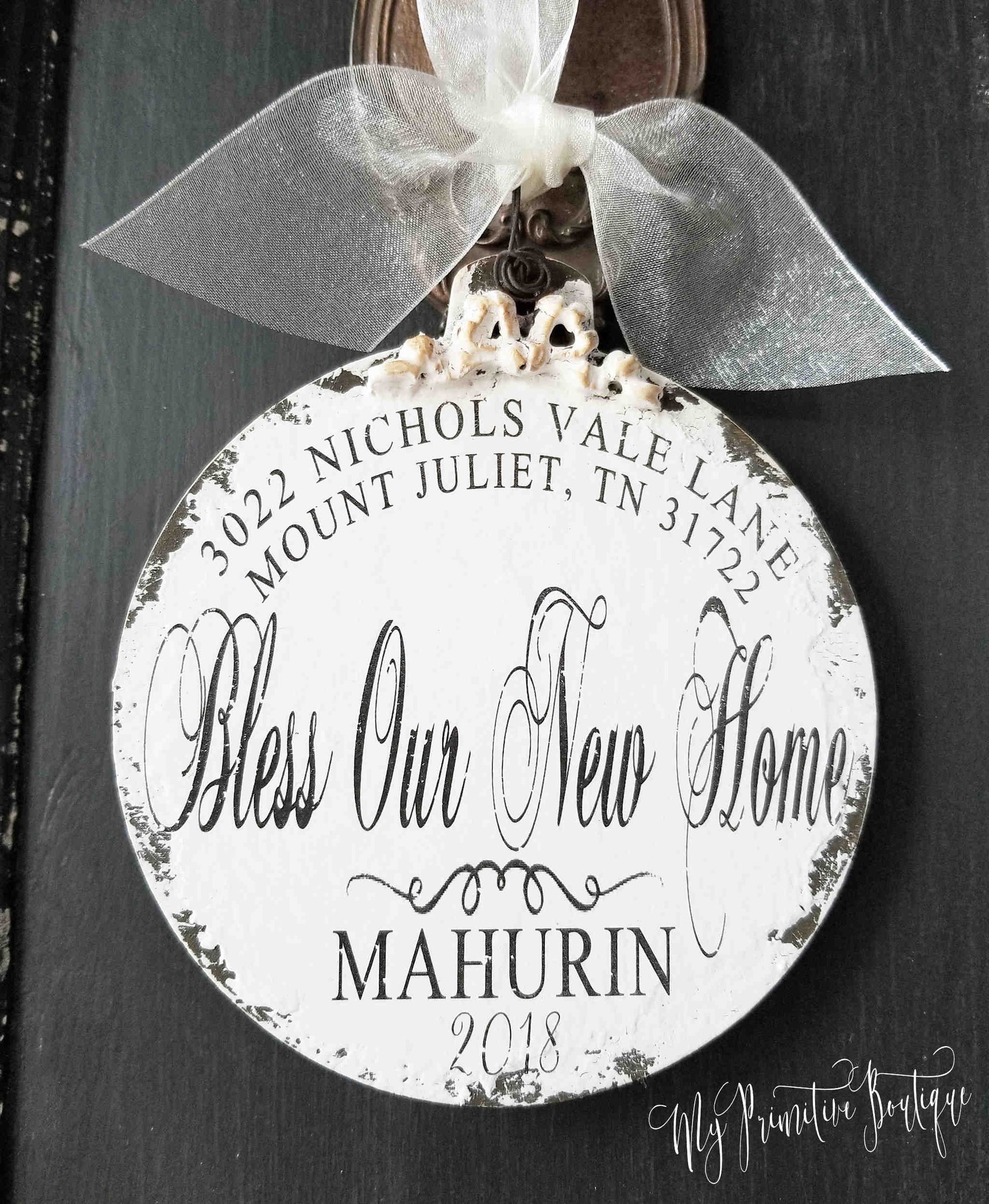 Personalized wooden ball ornament with family name, address, and year rustic distressed finish