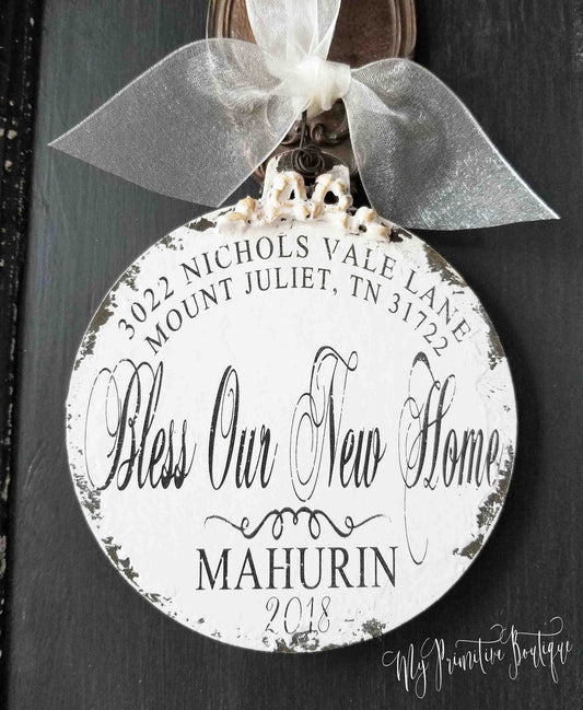Personalized wooden ball ornament with family name, address, and year rustic distressed finish