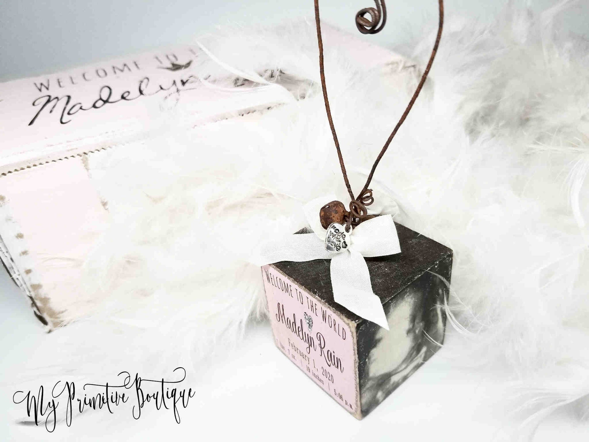 Personalized baby’s first Christmas ornament with Welcome to the World message rustic farmhouse style.