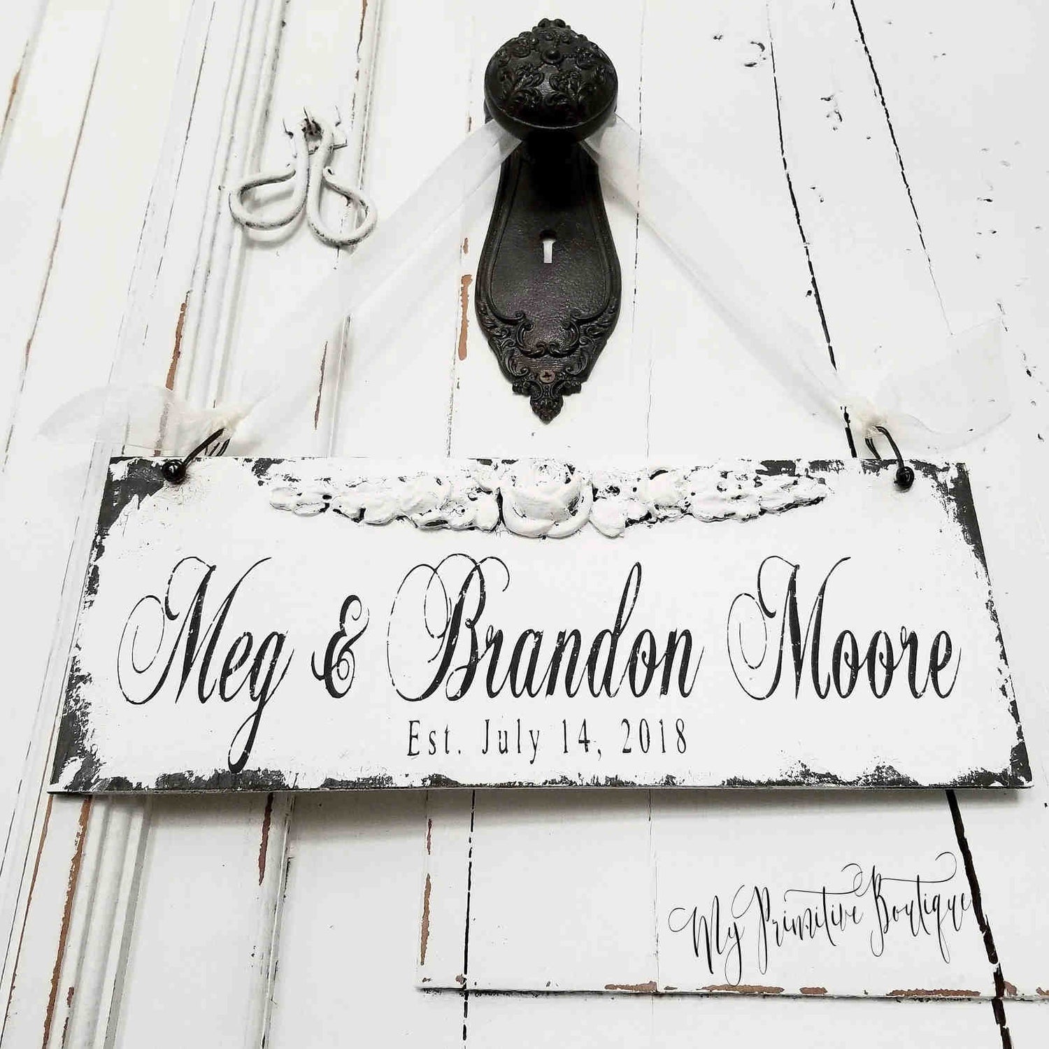 Heirloom custom family name sign hand painted on rustic distressed wood personalized with first names, last name, and wedding date