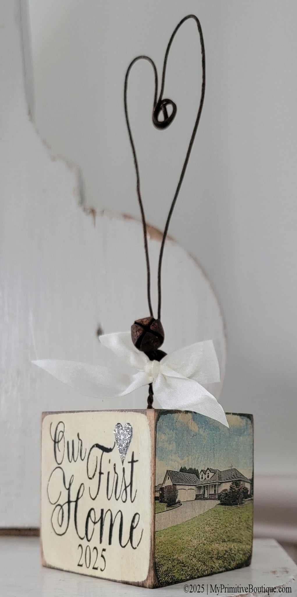 Rustic ivory wood Christmas ornament with wire heart hanger and silver heart accent, personalized with address and purchase date.