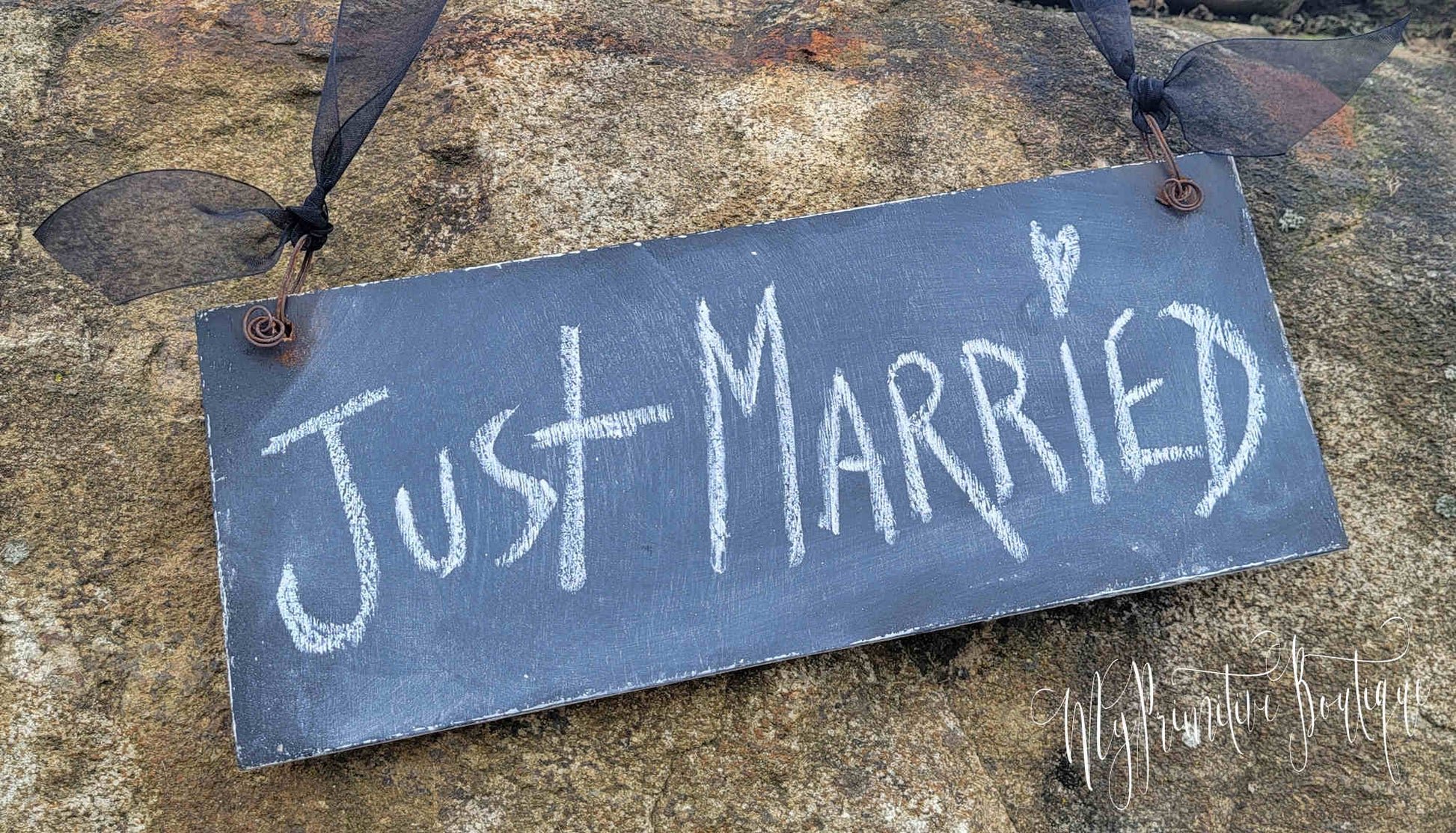 Our save the date sign has a chalkboard on the back so you can create your own messages.